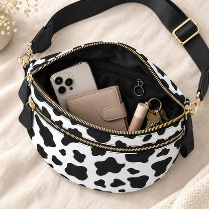 Open ZOCOIFY Everyday Roomy Crossbody Bag in cow print showing phone, wallet, keys and lip balm inside