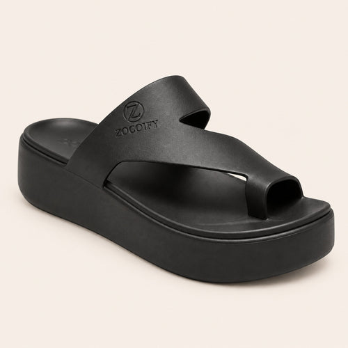 ZOCOIFY Amara black hero toe-loop platform sandals, cream studio background