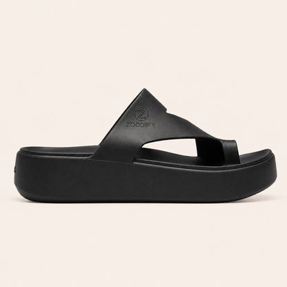 ZOCOIFY Amara black side toe-loop platform sandals, cream studio background